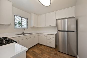Kitchens include: refrigerator, stove, range, and garbage disposal